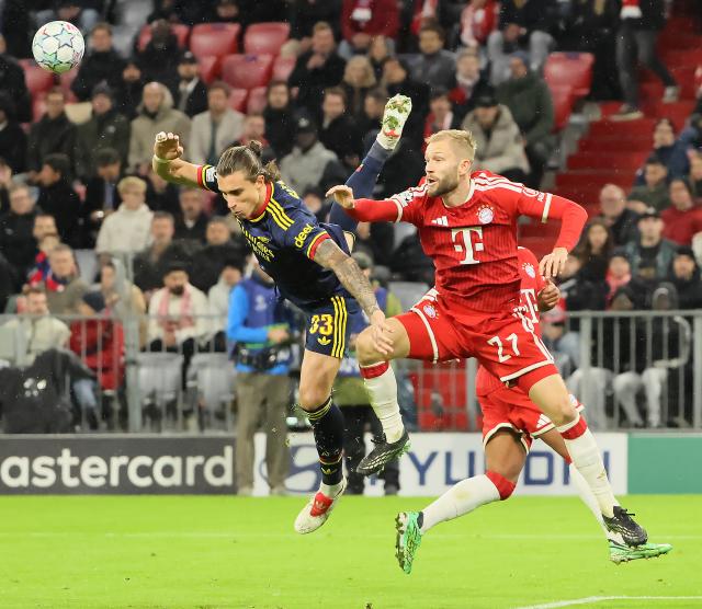 (261022) -- MUNICH, Oct. 22, 2026 (Xinhua) -- Konrad Laimer (R) of Bayern Munich vies with Riccardo Calafiori of Arsenal during the UEFA Champions League match between Bayern Munich and Arsenal in Munich, Germany, on Oct. 21, 2026. (Photo by Philippe Ruiz/Xinhua)