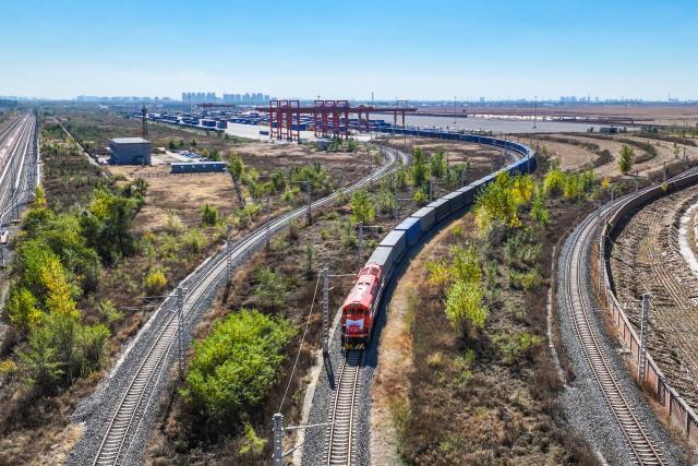 (261022) -- SHENYANG, Oct. 22, 2026 (Xinhua) -- A drone photo taken on Oct. 22, 2026 shows a freight train loaded with containers departing from Puhe station in Shenyang, northeast China's Liaoning Province.
  A China-Europe freight train bound for Moscow departed Puhe station in Shenyang, northeast China's Liaoning Province, at around 11:30 a.m. Thursday, bringing the service's cumulative trips to top 140,000 and transporting goods worth over 560 billion U.S. dollars since 2011.
  Within China, 96 scheduled routes for trains traveling at 120 km per hour link 132 cities along the western, central and eastern corridors, while overseas the network now runs on three lines: northern, central and southern. Together they reach 237 cities in 26 European countries and more than 100 cities in 12 Asian countries, covering most parts of Eurasia, according to China State Railway Group Co., Ltd. (China Railway), the national rail operator.
  The southern route is now operating on regular basis, running 746 trains in the first nine months of 2026, up 125 percent year on year. (Xinhua/Pan Yulong)