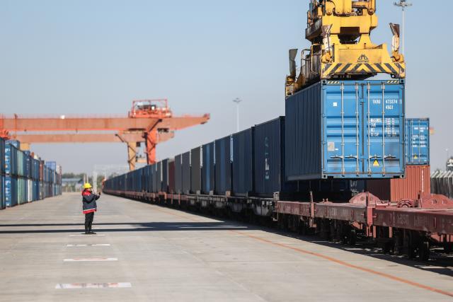 (261022) -- SHENYANG, Oct. 22, 2026 (Xinhua) -- A freight train is being loaded with containers before departure at Puhe station in Shenyang, northeast China's Liaoning Province, Oct. 22, 2026.
  A China-Europe freight train bound for Moscow departed Puhe station in Shenyang, northeast China's Liaoning Province, at around 11:30 a.m. Thursday, bringing the service's cumulative trips to top 140,000 and transporting goods worth over 560 billion U.S. dollars since 2011.
  Within China, 96 scheduled routes for trains traveling at 120 km per hour link 132 cities along the western, central and eastern corridors, while overseas the network now runs on three lines: northern, central and southern. Together they reach 237 cities in 26 European countries and more than 100 cities in 12 Asian countries, covering most parts of Eurasia, according to China State Railway Group Co., Ltd. (China Railway), the national rail operator.
  The southern route is now operating on regular basis, running 746 trains in the first nine months of 2026, up 125 percent year on year. (Xinhua/Pan Yulong)