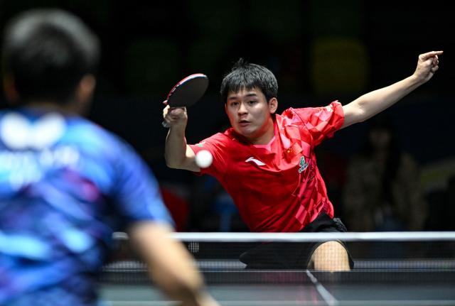 (261022) -- TASHKENT, Oct. 22, 2026 (Xinhua) -- Lin Shidong (R) of China hits a return during the men's teams semifinals against Feng Yi-Hsin of Chinese Taipei at the 29th ITTF-Asian Table Tennis Championships in Tashkent, Uzbekistan, Oct. 22, 2026. (Xinhua/Feng Kaihua)