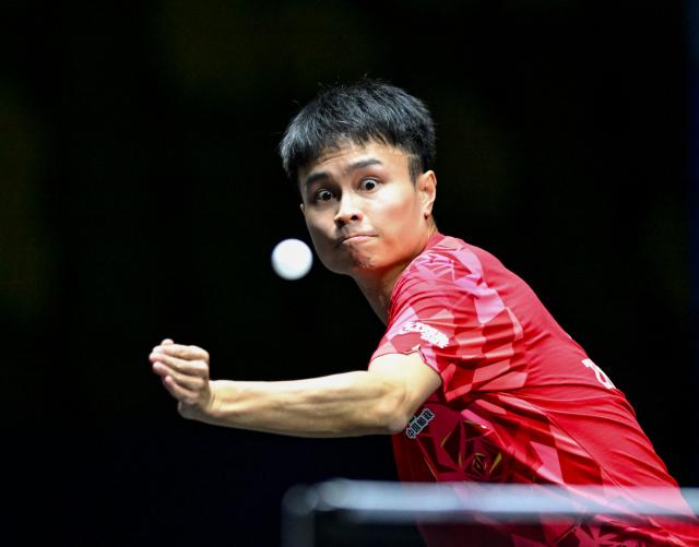 (261022) -- TASHKENT, Oct. 22, 2026 (Xinhua) -- Zhou Qihao of China hits a return during the men's teams semifinals against Hsu Hsien-Chia of Chinese Taipei at the 29th ITTF-Asian Table Tennis Championships in Tashkent, Uzbekistan, Oct. 22, 2026. (Xinhua/Feng Kaihua)