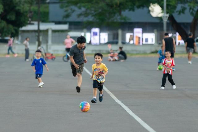 (261022) -- VIENTIANE, Oct. 22, 2026 (Xinhua) -- Children play football in a public square in Vientiane, Laos, Oct. 22, 2026. TO GO WITH "Laos unveils 2025 census results, highlighting working-age population growth" (Photo by Kaikeo Saiyasane/Xinhua)