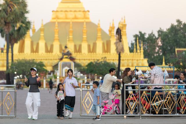(261022) -- VIENTIANE, Oct. 22, 2026 (Xinhua) -- People visit a public square in Vientiane, Laos, Oct. 22, 2026. TO GO WITH "Laos unveils 2025 census results, highlighting working-age population growth" (Photo by Kaikeo Saiyasane/Xinhua)