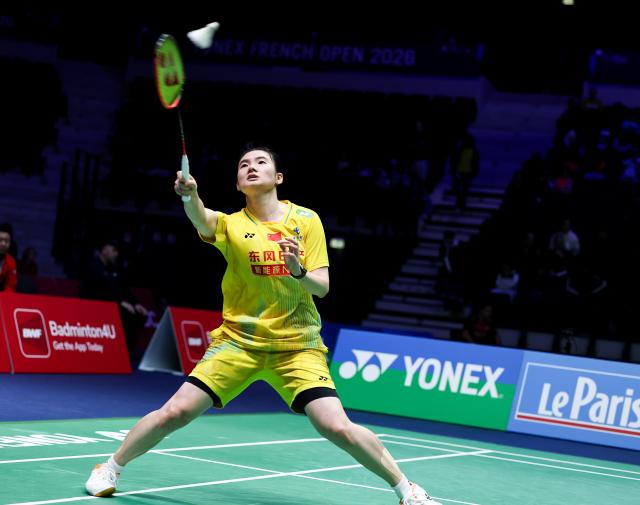 (261022) -- PARIS, Oct. 22, 2026 (Xinhua) -- Han Yue of China hits a return during the women's singles round of 16 match against Mia Blichfeldt of Denmark at the French Open badminton tournament in Paris, France, Oct. 22, 2026. (Xinhua/Wu Huiwo)