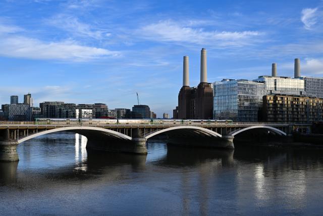 (261022) -- LONDON, Oct. 22, 2026 (Xinhua) -- This photo taken on Oct. 22, 2026 shows a view of Battersea Power Station seen from Chelsea Bridge in London, Britain. Located on the south bank of the River Thames in London, Battersea Power Station was built in two main phases between 1929 and 1955. At its peak, the coal-fired power station supplied about one-fifth of London's electricity, powering important buildings including Buckingham Palace and the Houses of Parliament.
The building, known for its four white chimneys, stood derelict for decades after electricity generation ceased in 1983. Following restoration and redevelopment, the former industrial landmark reopened to the public in 2022 as a mixed-use complex featuring shops, restaurants, offices, homes and leisure facilities. (Xinhua/Li Mangmang)