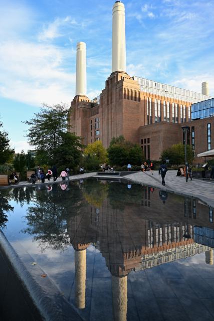 (261022) -- LONDON, Oct. 22, 2026 (Xinhua) -- This photo taken on Oct. 22, 2026 shows a view of Battersea Power Station in London, Britain. Located on the south bank of the River Thames in London, Battersea Power Station was built in two main phases between 1929 and 1955. At its peak, the coal-fired power station supplied about one-fifth of London's electricity, powering important buildings including Buckingham Palace and the Houses of Parliament.
The building, known for its four white chimneys, stood derelict for decades after electricity generation ceased in 1983. Following restoration and redevelopment, the former industrial landmark reopened to the public in 2022 as a mixed-use complex featuring shops, restaurants, offices, homes and leisure facilities. (Xinhua/Li Mangmang)