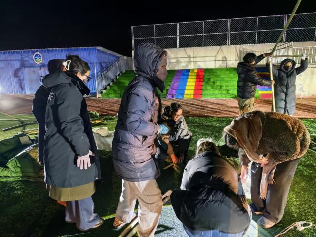 (261023) -- NAGQU, Oct. 23, 2026 (Xinhua) -- Tents are being set up for quake-affected residents at a primary school in Baqen County of Nagqu City, southwest China's Xizang Autonomous Region, Oct. 23, 2026.
  Sixteen people were killed and 32 others injured after a 7.0-magnitude earthquake struck Baqen County of Nagqu City in southwest China's Xizang Autonomous Region at 10:33 p.m. Thursday (Beijing Time), according to the city's emergency management bureau.
  The damage caused by the quake is being further evaluated, and disaster relief work is underway.
  Xizang has activated a Level-II earthquake disaster emergency response, according to the regional emergency command center. (Xinhua)