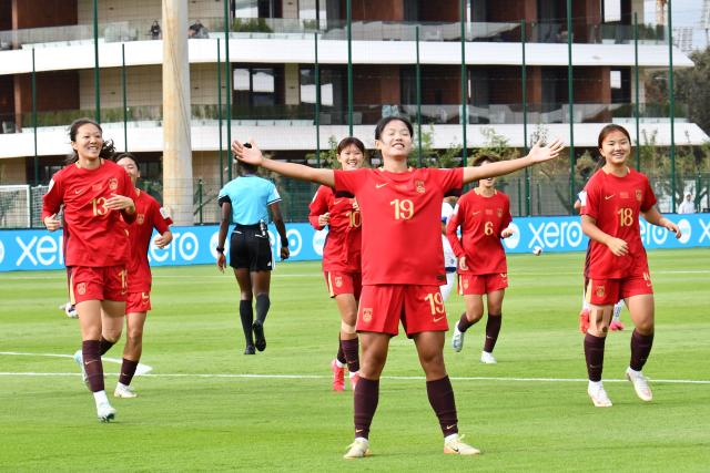 (261023) -- RABAT, Oct. 23, 2026 (Xinhua) -- China's Fang Zhenzhu (front) celebrates after scoring during the Group E match between China and Samoa at the 2026 FIFA U-17 Women's World Cup in Rabat, Morocco, on Oct. 22, 2026. (Photo by Aissa/Xinhua)