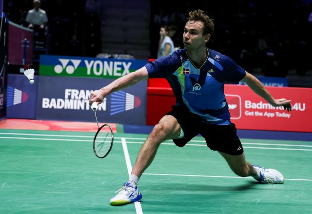 (261023) -- PARIS, Oct. 23, 2026 (Xinhua) -- Rasmus Gemke of Denmark hits a return during the men's singles 1/8 final match between Christo Popov of France and Rasmus Gemke of Denmark at the French Open badminton tournament in Paris, France, Oct. 22, 2026. (Xinhua/Wu Huiwo)