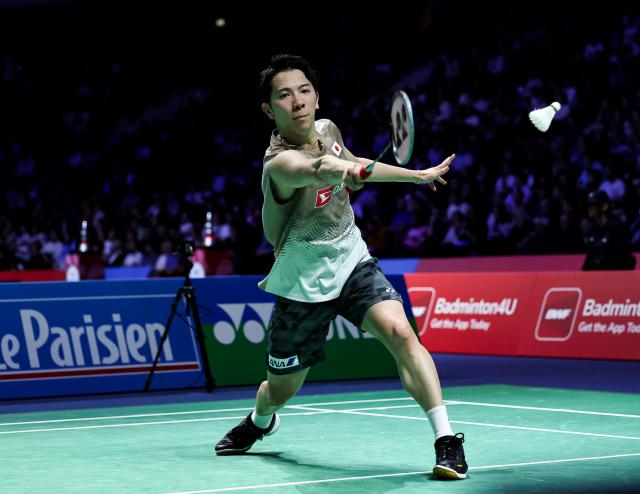 (261023) -- PARIS, Oct. 23, 2026 (Xinhua) -- Watanabe Koki of Japan hits a return during the men's singles 1/8 final match between Moh. Zaki Ubaidillah of Indonesia and Watanabe Koki of Japan at the French Open badminton tournament in Paris, France, Oct. 22, 2026. (Xinhua/Wu Huiwo)