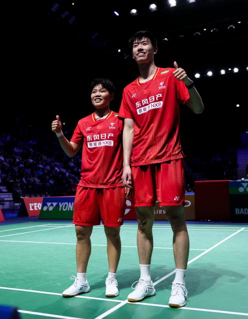 (261023) -- PARIS, Oct. 23, 2026 (Xinhua) -- Feng Yanzhe (R)/Huang Dongping of China pose for a photo after the mixed doubles 1/8 final match between Feng Yanzhe/Huang Dongping of China and Ruben Garcia/Lucia Rodriguez of Spain at the French Open badminton tournament in Paris, France, Oct. 22, 2026. (Xinhua/Wu Huiwo)