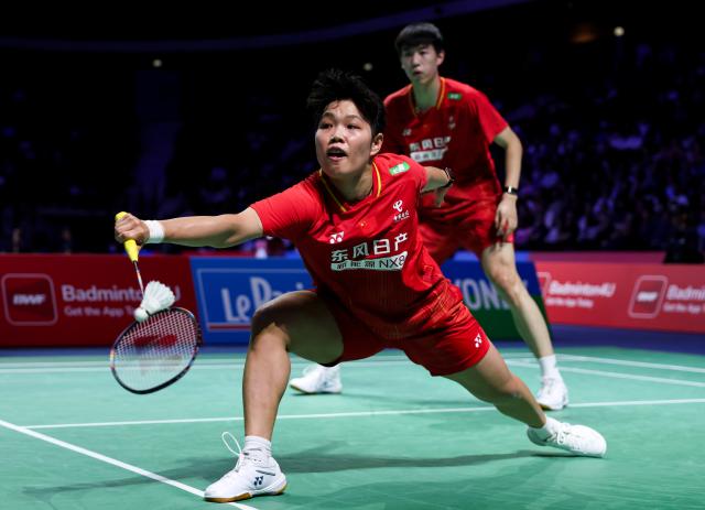(261023) -- PARIS, Oct. 23, 2026 (Xinhua) -- Huang Dongping (L)/Feng Yanzhe of China compete during the mixed doubles 1/8 final match between Feng Yanzhe/Huang Dongping of China and Ruben Garcia/Lucia Rodriguez of Spain at the French Open badminton tournament in Paris, France, Oct. 22, 2026. (Xinhua/Wu Huiwo)