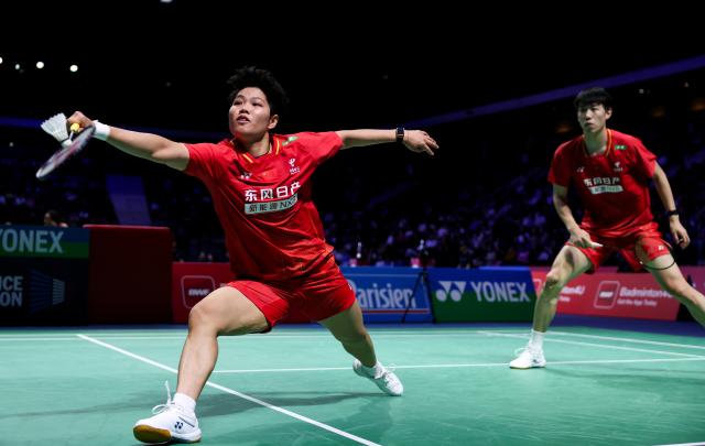 (261023) -- PARIS, Oct. 23, 2026 (Xinhua) -- Huang Dongping (L)/Feng Yanzhe of China compete during the mixed doubles 1/8 final match between Feng Yanzhe/Huang Dongping of China and Ruben Garcia/Lucia Rodriguez of Spain at the French Open badminton tournament in Paris, France, Oct. 22, 2026. (Xinhua/Wu Huiwo)