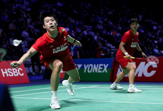 (261023) -- PARIS, Oct. 23, 2026 (Xinhua) -- Feng Yanzhe (L)/Huang Dongping of China compete during the mixed doubles 1/8 final match between Feng Yanzhe/Huang Dongping of China and Ruben Garcia/Lucia Rodriguez of Spain at the French Open badminton tournament in Paris, France, Oct. 22, 2026. (Xinhua/Wu Huiwo)