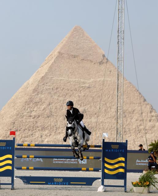 (261023) -- CAIRO, Oct. 23, 2026 (Xinhua) -- Mouda Zeyada of Egypt competes during the CSI5 1.60 meters competition of the Global Champions Tour 2026 at The Great Pyramids, Giza, Egypt on Oct. 22, 2026. (Xinhua/Ahmed Gomaa)