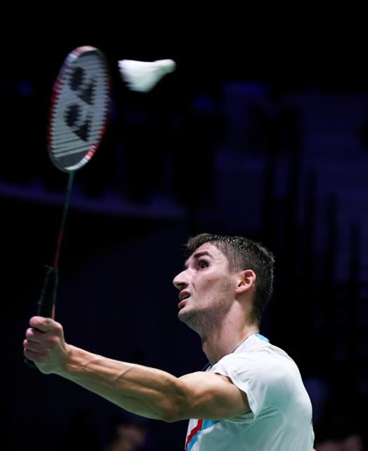 (261023) -- PARIS, Oct. 23, 2026 (Xinhua) -- Christo Popov of France hits a return during the men's singles 1/8 final match between Christo Popov of France and Rasmus Gemke of Denmark at the French Open badminton tournament in Paris, France, Oct. 22, 2026. (Xinhua/Wu Huiwo)