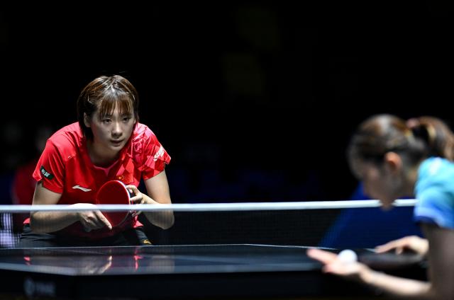 (261023) -- TASHKENT, Oct. 23, 2026 (Xinhua) -- Chen Yi (L) of China looks on as Hashimoto Honoka of Japan serves during the women's teams final between China and Japan at the 29th ITTF-Asian Table Tennis Championships in Tashkent, Uzbekistan, Oct. 22, 2026. (Xinhua/Feng Kaihua)