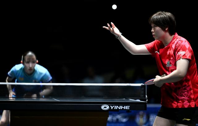 (261023) -- TASHKENT, Oct. 23, 2026 (Xinhua) -- Kuai Man (R) of China serves against Hayata Hina of Japan during the women's teams final between China and Japan at the 29th ITTF-Asian Table Tennis Championships in Tashkent, Uzbekistan, Oct. 22, 2026. (Xinhua/Feng Kaihua)