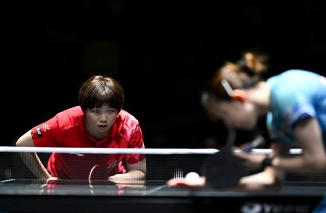 (261023) -- TASHKENT, Oct. 23, 2026 (Xinhua) -- Kuai Man (L) of China looks on as Hayata Hina of Japan serves during the women's teams final between China and Japan at the 29th ITTF-Asian Table Tennis Championships in Tashkent, Uzbekistan, Oct. 22, 2026. (Xinhua/Feng Kaihua)