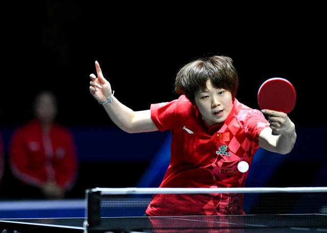 (261023) -- TASHKENT, Oct. 23, 2026 (Xinhua) -- Kuai Man of China hits a return against Hayata Hina of Japan during the women's teams final between China and Japan at the 29th ITTF-Asian Table Tennis Championships in Tashkent, Uzbekistan, Oct. 22, 2026. (Xinhua/Feng Kaihua)