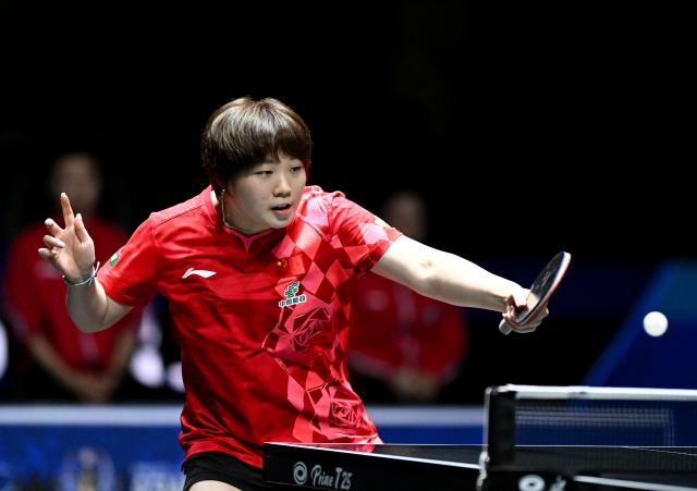 (261023) -- TASHKENT, Oct. 23, 2026 (Xinhua) -- Kuai Man of China hits a return against Hayata Hina of Japan during the women's teams final between China and Japan at the 29th ITTF-Asian Table Tennis Championships in Tashkent, Uzbekistan, Oct. 22, 2026. (Xinhua/Feng Kaihua)