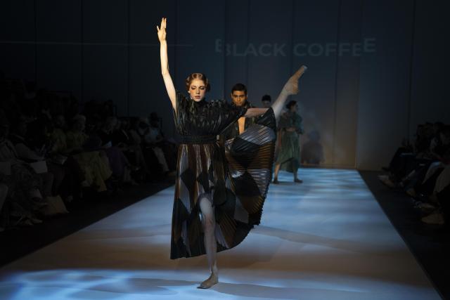 (261023) -- JOHANNESBURG, Oct. 23, 2026 (Xinhua) -- A model presents a creation from the Autumn/Winter 2027 collections during the South African Fashion Week in Johannesburg, South Africa, Oct. 22, 2026. (Photo by Ihsaan Haffejee/Xinhua)