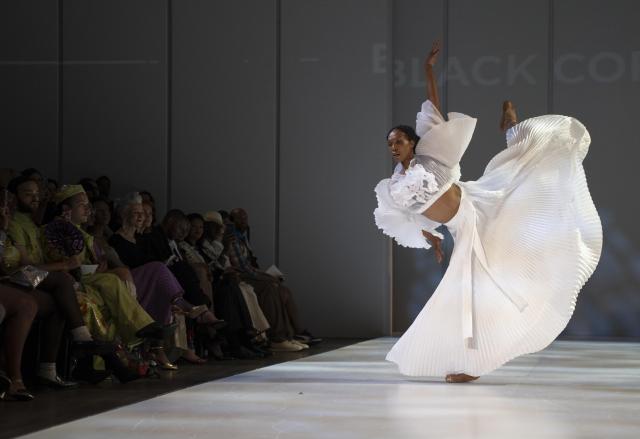 (261023) -- JOHANNESBURG, Oct. 23, 2026 (Xinhua) -- A model presents a creation from the Autumn/Winter 2027 collections during the South African Fashion Week in Johannesburg, South Africa, Oct. 22, 2026. (Photo by Ihsaan Haffejee/Xinhua)