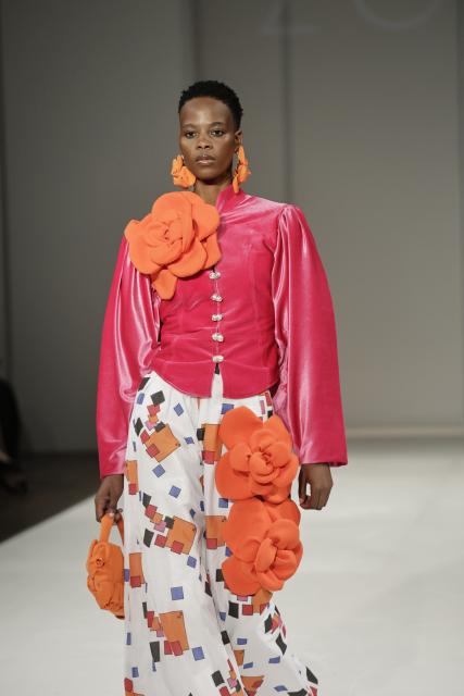 (261023) -- JOHANNESBURG, Oct. 23, 2026 (Xinhua) -- A model presents a creation from the Autumn/Winter 2027 collections during the South African Fashion Week in Johannesburg, South Africa, Oct. 22, 2026. (Photo by James Blackmore/Xinhua)