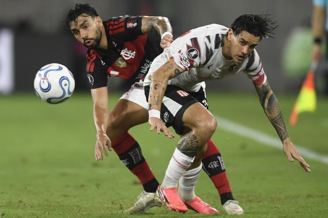(261023) -- RIO DE JANEIRO, Oct. 23, 2026 (Xinhua) -- Lucas Paqueta (L) of Flamengo vies with Joaquin Correa of Estudiantes de La Plata during the second leg of the Copa Libertadores semifinal football match between Brazil's Flamengo and Argentina's Estudiantes de La Plata at the Maracana stadium in Rio de Janeiro, Brazil, Oct. 22, 2026. (Photo by Daniel Ramalho/Xinhua)