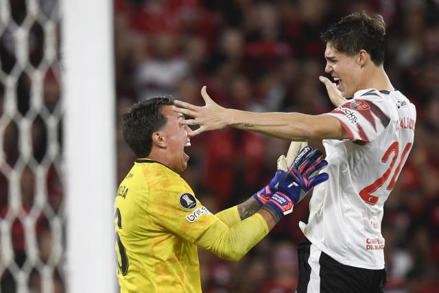(261023) -- RIO DE JANEIRO, Oct. 23, 2026 (Xinhua) -- Tomas Palacios (R) and Fernando Muslera of Estudiantes de La Plata celebrate winning the penalty shootout of the second leg of the Copa Libertadores semifinal football match between Brazil's Flamengo and Argentina's Estudiantes de La Plata at the Maracana stadium in Rio de Janeiro, Brazil, Oct. 22, 2026. (Photo by Daniel Ramalho/Xinhua)