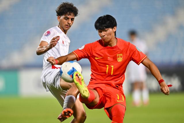 (261023) -- DOHA, Oct. 23, 2026 (Xinhua) -- Liu Yuyang (R) of China vies with Mohamed Salah Algalal of Bahrain during the Gulf Football Federation (GFF) Gulf Cup U-17 Qatar 2026 football match between China and Bahrain in Doha, Qatar, Oct. 22, 2026. (Photo by Nikku/Xinhua)