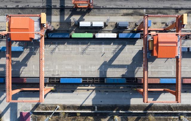 (261023) -- HARBIN, Oct. 23, 2026 (Xinhua) -- An aerial drone photo taken on Oct. 23, 2026 shows transshipment operations at the transshipment yard at Tongjiang North Railway Station in Tongjiang, northeast China's Heilongjiang Province. According to China Railway Harbin Group, a total of 6,024 China-Europe freight train trips have been made via the eastern corridor of the China-Europe freight train service so far this year, up 40.3 percent year on year. (Photo by Wu Yunan/Xinhua)