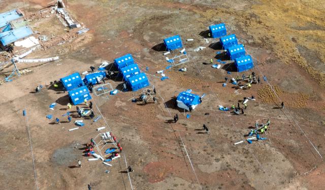(261023) -- LHASA, Oct. 23, 2026 (Xinhua) -- An aerial drone photo taken on Oct. 23, 2026 shows emergency tents at an earthquake-hit village in Maru Township of Baqen County, Nagqu City, southwest China's Xizang Autonomous Region. Sixteen people have been killed and 76 others are injured following a 7.0-magnitude earthquake which struck Baqen County of the city of Nagqu in southwest China's Xizang Autonomous Region at 10:33 p.m. on Thursday, local authorities said.
   The Ministry of Emergency Management and authorities in Xizang have mobilized resources for rescue and relief operations. (Xinhua/Tenzin Nyida)