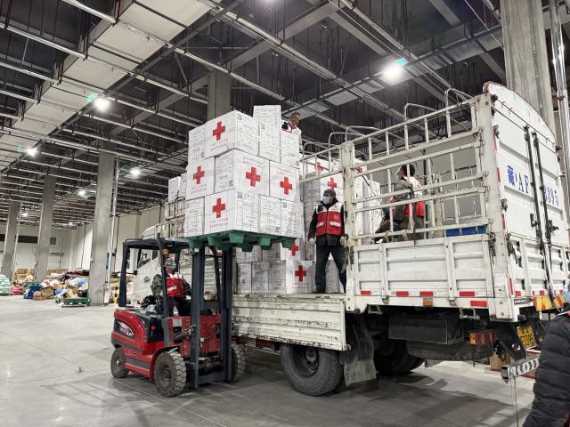 (261023) -- LHASA, Oct. 23, 2026 (Xinhua) -- Staff members transfer relief supplies in Lhasa, southwest China's Xizang Autonomous Region, Oct. 23, 2026. A 7.0-magnitude earthquake struck Baqen County of Nagqu City in southwest China's Xizang Autonomous Region, at 10:33 p.m. Thursday (Beijing Time), according to the China Earthquake Networks Center (CENC).
   The Red Cross Society of China has dispatched a working team to the disaster-hit area to guide local relief efforts. It has also allocated 3,800 sets of supplies, including family relief kits, hygiene kits, heaters, tents, jackets, folding beds and quilts. (Xinhua)