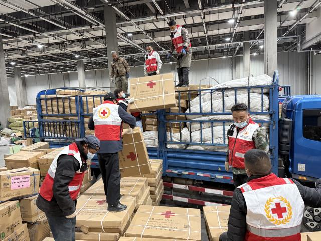 (261023) -- LHASA, Oct. 23, 2026 (Xinhua) -- Staff members transfer relief supplies in Lhasa, southwest China's Xizang Autonomous Region, Oct. 23, 2026. A 7.0-magnitude earthquake struck Baqen County of Nagqu City in southwest China's Xizang Autonomous Region, at 10:33 p.m. Thursday (Beijing Time), according to the China Earthquake Networks Center (CENC).
   The Red Cross Society of China has dispatched a working team to the disaster-hit area to guide local relief efforts. It has also allocated 3,800 sets of supplies, including family relief kits, hygiene kits, heaters, tents, jackets, folding beds and quilts. (Xinhua)