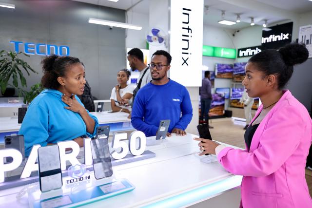 (261023) -- NAIROBI, Oct. 23, 2026 (Xinhua) -- Customers select smartphones at a Tecno store in Addis Ababa, Ethiopia, Oct. 13, 2026. TO GO WITH "Feature: Chinese smartphones help narrow digital divide in Africa" (Xinhua/Geng Xinning)