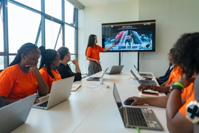 (261023) -- NAIROBI, Oct. 23, 2026 (Xinhua) -- Staff members discuss the marketing strategy at the Tecno office in Nairobi, Kenya, Aug. 25, 2026. TO GO WITH "Feature: Chinese smartphones help narrow digital divide in Africa" (Xinhua/Xie Jianfei)
