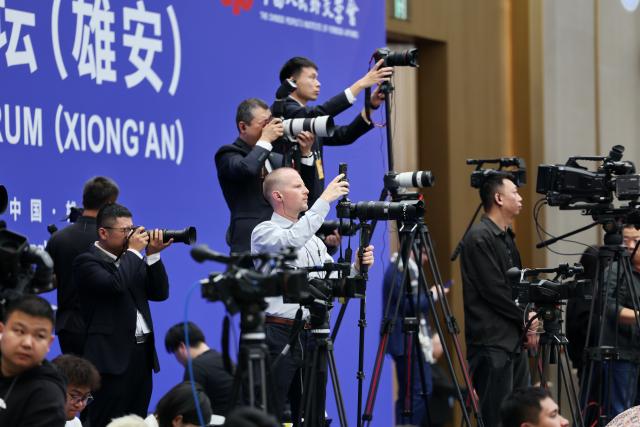 (261023) -- XIONG'AN, Oct. 23, 2026 (Xinhua) -- Media staff work during the opening ceremony of the 2026 Global Governance Forum (Xiong'an) in Xiong'an New Area, north China's Hebei Province, Oct. 23, 2026. The 2026 Global Governance Forum (Xiong'an) kicked off here on Friday.
   Hosted by the Chinese People's Institute of Foreign Affairs, the forum is themed "Rebuilding Confidence and Cooperation: Reforming and Improving Global Governance in a Transforming World." (Xinhua/Mu Yu)