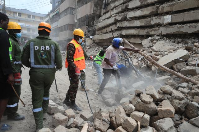 (261023) -- NAIROBI, Oct. 23, 2026 (Xinhua) -- Rescuers work at the site of a building collapse accident in Eastleigh, Nairobi, Kenya, Oct. 23, 2026. Several people are feared trapped after an 18-story building under construction collapsed Friday afternoon in Eastleigh, a high-density commercial and residential suburb of Nairobi, the Kenyan capital. (Photo by Henry Naminde/Xinhua)