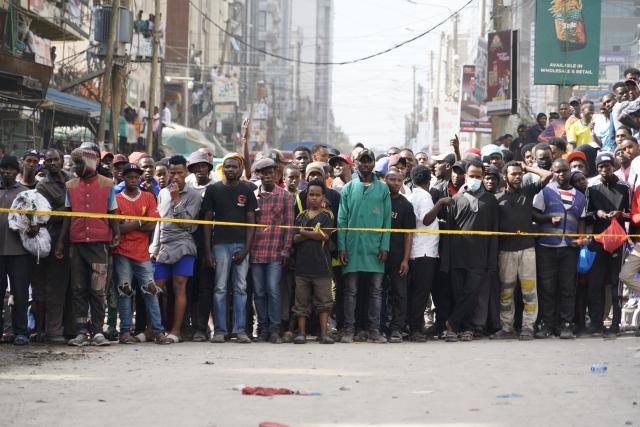 (261023) -- NAIROBI, Oct. 23, 2026 (Xinhua) -- Residents are seen near the site of a building collapse accident in Eastleigh, Nairobi, Kenya, Oct. 23, 2026. Several people are feared trapped after an 18-story building under construction collapsed Friday afternoon in Eastleigh, a high-density commercial and residential suburb of Nairobi, the Kenyan capital. (Xinhua/Xie Jianfei)