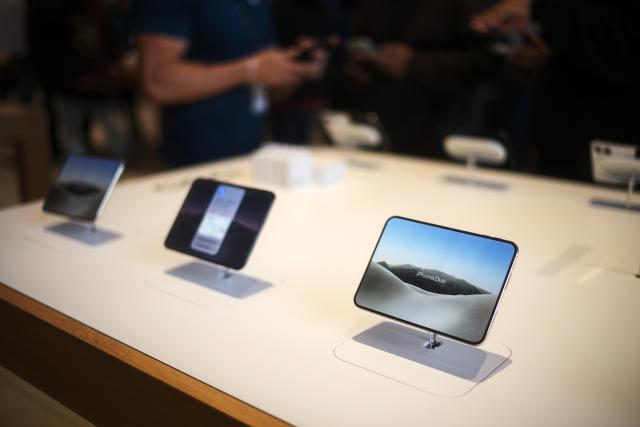 (261023) -- MEXICO CITY, Oct. 23, 2026 (Xinhua) -- Photo taken on Oct. 23, 2026 shows iPhone Duo on display at an Apple Store in Mexico City, Mexico. Apple's first foldable smartphone, the iPhone Duo, officially went on sale on Oct. 23, 2026, in the first wave of markets worldwide, including Mexico. (Xinhua/Li Muzi)