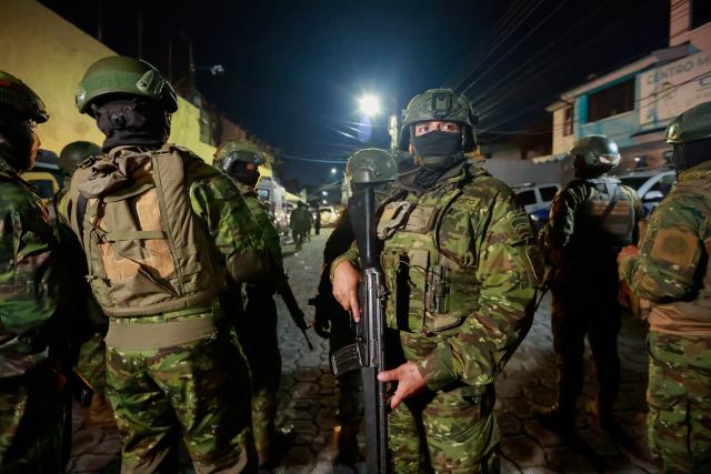 (261023) -- QUITO, Oct. 23, 2026 (Xinhua) -- Photo taken on Oct. 22, 2026 shows Ecuadorian military personnel deployed near El Inca prison, in northern Quito, capital of Ecuador. Eight inmates were killed Thursday in two separate riots at prisons in the Andean provinces of Cotopaxi and Pichincha in Ecuador, the National Service for Comprehensive Care for Adults Deprived of Liberty and Adolescent Offenders (SNAI) said. (Photo by Ricardo Landeta/Xinhua)