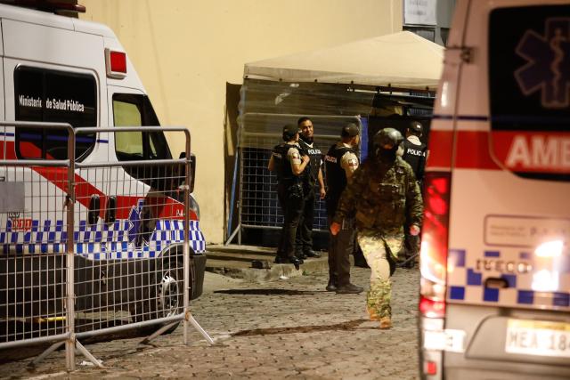 (261023) -- QUITO, Oct. 23, 2026 (Xinhua) -- Photo taken on Oct. 22, 2026 shows ambulances deployed outside El Inca prison in northern Quito, capital of Ecuador. Eight inmates were killed Thursday in two separate riots at prisons in the Andean provinces of Cotopaxi and Pichincha in Ecuador, the National Service for Comprehensive Care for Adults Deprived of Liberty and Adolescent Offenders (SNAI) said. (Photo by Ricardo Landeta/Xinhua)