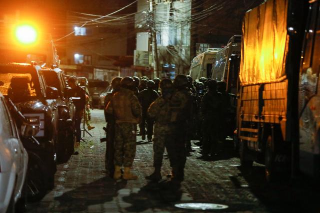 (261023) -- QUITO, Oct. 23, 2026 (Xinhua) -- Photo taken on Oct. 22, 2026 shows Ecuadorian military personnel deployed near El Inca prison, in northern Quito, capital of Ecuador. Eight inmates were killed Thursday in two separate riots at prisons in the Andean provinces of Cotopaxi and Pichincha in Ecuador, the National Service for Comprehensive Care for Adults Deprived of Liberty and Adolescent Offenders (SNAI) said. (Photo by Ricardo Landeta/Xinhua)