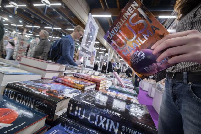 (261023) -- HELSINKI, Oct. 23, 2026 (Xinhua) -- Visitors browse Finnish translations of works by Chinese science fiction writers at the 2026 Helsinki Book Fair in Helsinki, Finland, Oct. 23, 2026. The 2026 Helsinki Book Fair is held from Oct. 22 to 25 at the Helsinki Expo and Convention Centre in the Finnish capital. (Photo by Matti Matikainen/Xinhua)