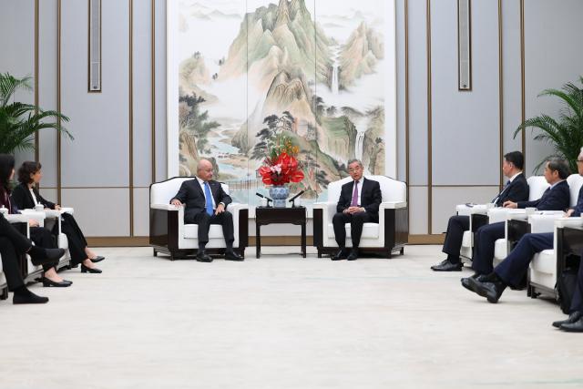 (261024) -- XIONG'AN, Oct. 24, 2026 (Xinhua) -- Chinese Foreign Minister Wang Yi, also a member of the Political Bureau of the Communist Party of China Central Committee, meets with UN High Commissioner for Refugees (UNHCR) Barham Salih, who is in China for the 2026 Global Governance Forum (Xiong'an), in Xiong'an New Area, north China's Hebei Province, Oct. 23, 2026. (Xinhua/Mu Yu)