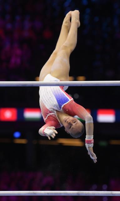 (261024) -- ROTTERDAM, Oct. 24, 2026 (Xinhua) -- Elena Colas of France competes during the uneven bars event of the women's all around final at the Artistic Gymnastics World Championships 2026 in Rotterdam, the Netherlands, Oct. 23, 2026. (Xinhua/Weng Xinyang)