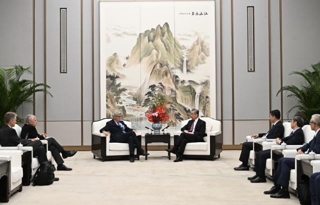 (261024) -- XIONG'AN, Oct. 24, 2026 (Xinhua) -- Chinese Foreign Minister Wang Yi, also a member of the Political Bureau of the Communist Party of China Central Committee, meets with co-chair of the Board of Trustees of the Asia Society John L. Thornton and The New York Times columnist Thomas L. Friedman, who are in China for the 2026 Global Governance Forum (Xiong'an), in Xiong'an New Area, north China's Hebei Province, Oct. 23, 2026. (Xinhua/Mu Yu)