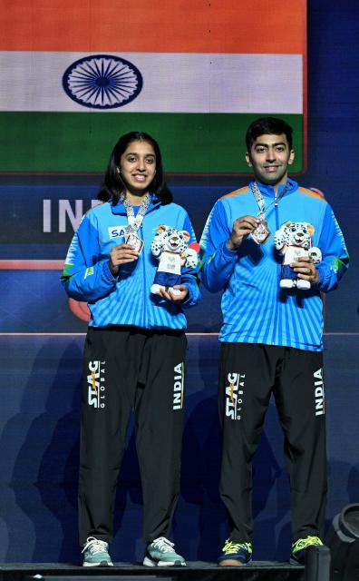 (261024) -- TASHKENT, Oct. 24, 2026 (Xinhua) -- Bronze medalists Harmeet Desai (R)/Yashaswini Ghorpade of India pose for a photo during the awarding ceremony for the mixed doubles at the 29th ITTF-Asian Table Tennis Championships in Tashkent, Uzbekistan, Oct. 23, 2026. (Xinhua/Feng Kaihua)