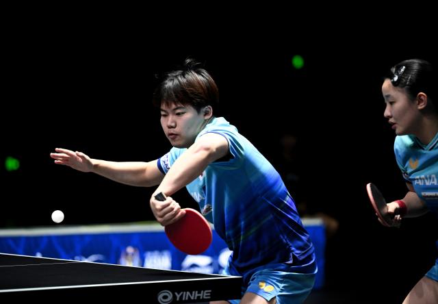 (261024) -- TASHKENT, Oct. 24, 2026 (Xinhua) -- Matsushima Sora (L)/Harimoto Miwa of Japan compete during the mixed doubles final against Huang Youzheng/Chen Yi of China at the 29th ITTF-Asian Table Tennis Championships in Tashkent, Uzbekistan, Oct. 23, 2026. (Xinhua/Feng Kaihua)